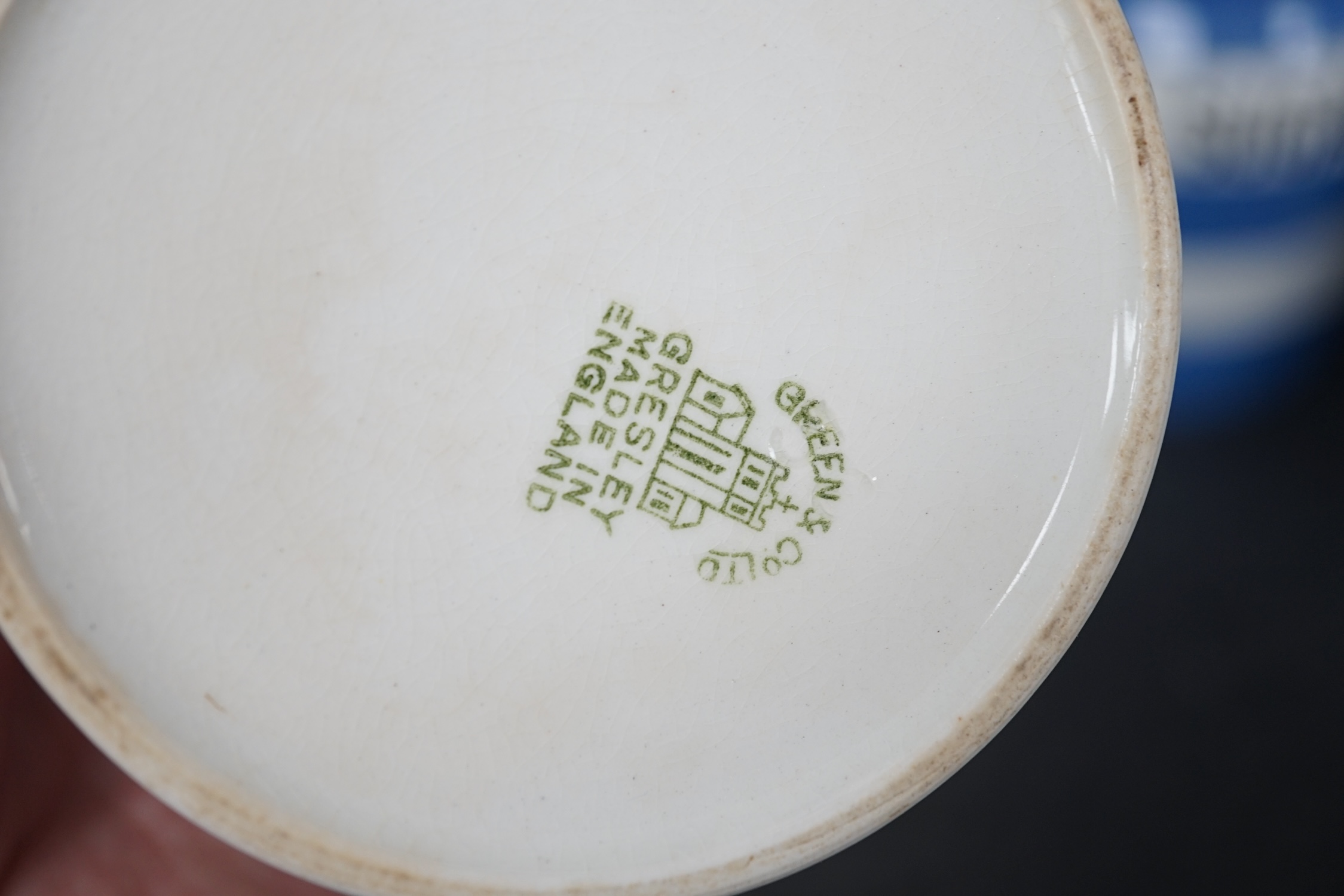 T.G.Green Cornish Kitchenware, thirteen 9cm lidded storage jars, to include Lemon Peel, Custard Powder, Nutmegs, Celery Seeds, Bisto, Parsley and Mint, together with an oval butter dish and two small jugs, mixed marks. C